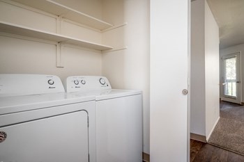 a washer and dryer in a laundry room - Photo Gallery 8