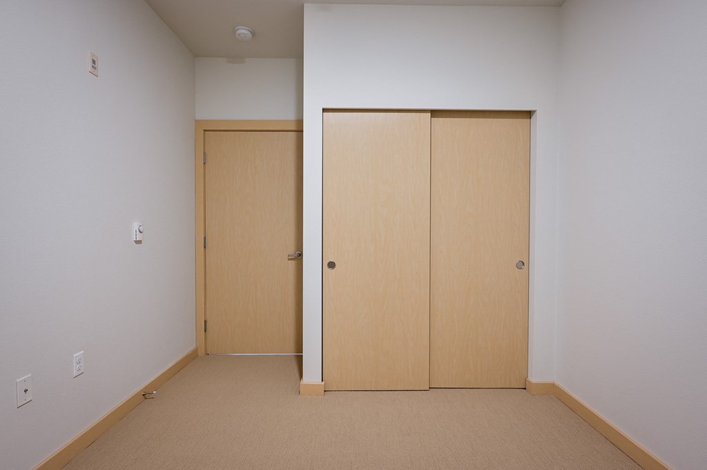 bedroom with double closet doors