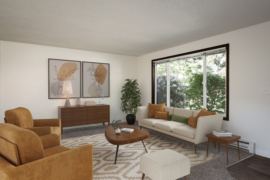 a living room with a white couch and a large window