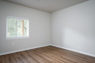 an empty room with white walls and a window - Photo Gallery