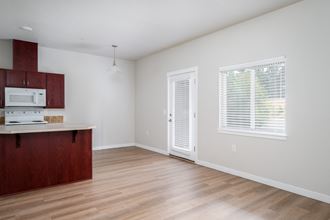 a kitchen and living room in a studio apartment - Photo Gallery