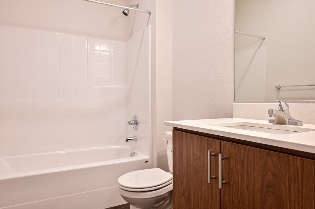 a bathroom with a toilet sink and bathtub