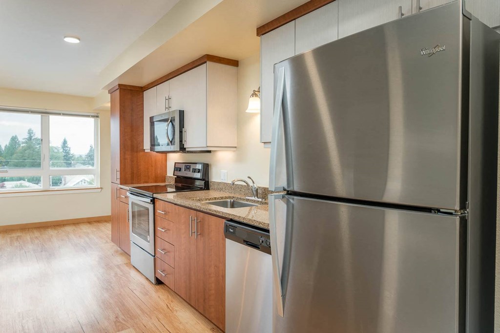 The Morgan | #404 Kitchen with beautiful cabinetry and stainless steel appliances