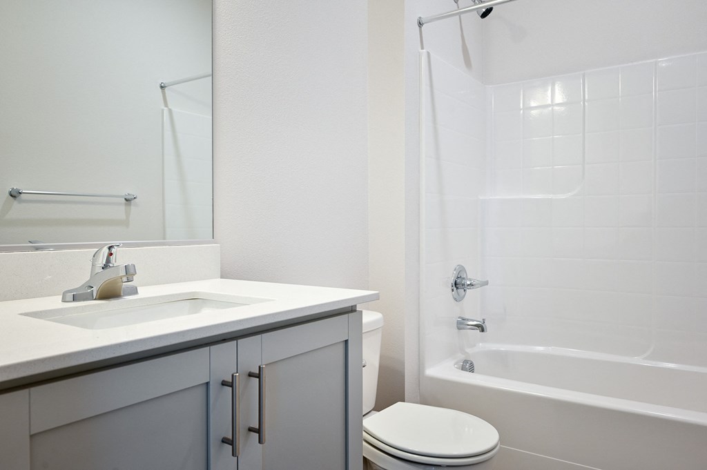 a bathroom with a sink toilet and bathtub