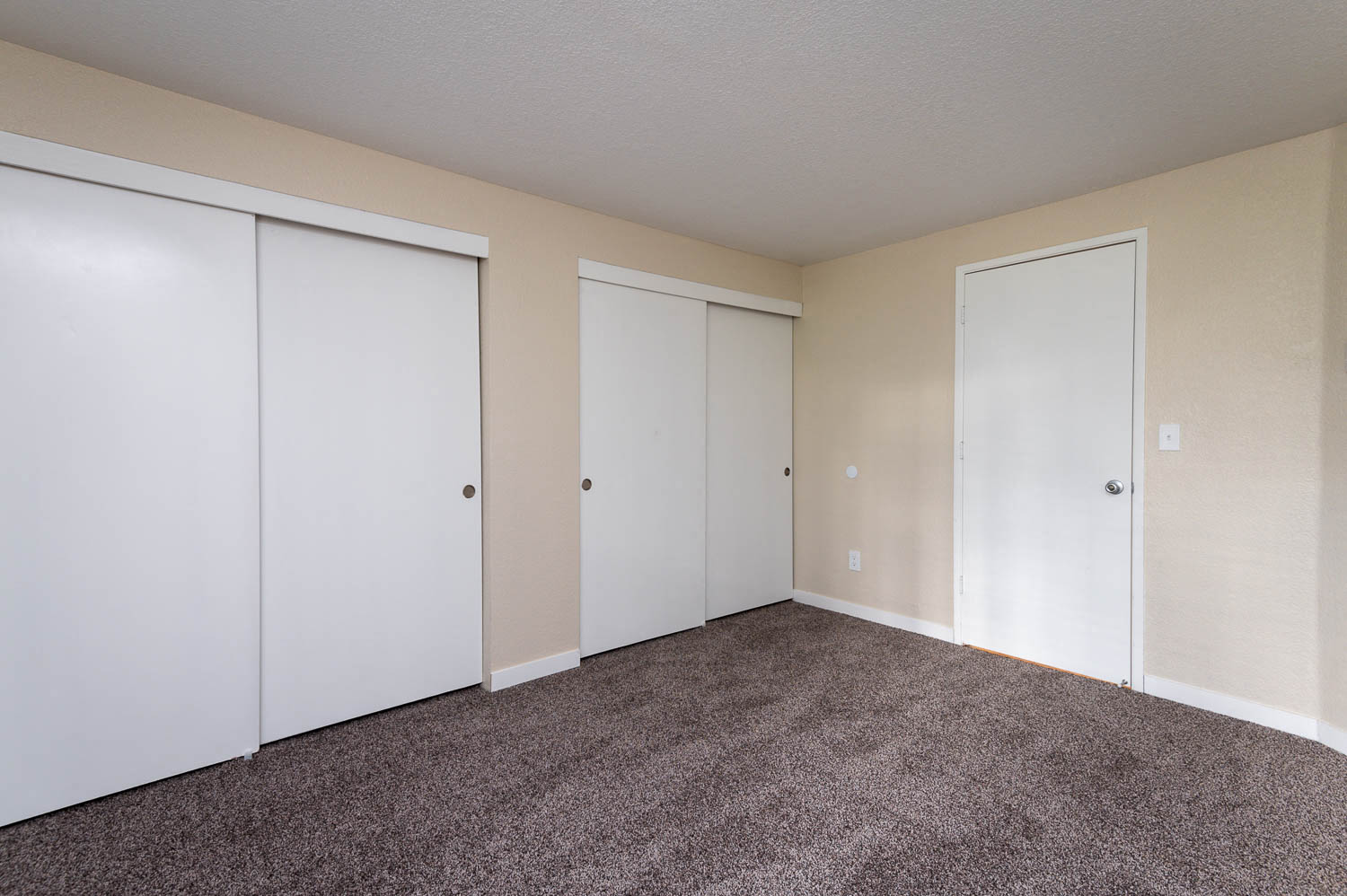 Sundial Apartments | Two Bedroom Primary Bedroom with Ample Closets