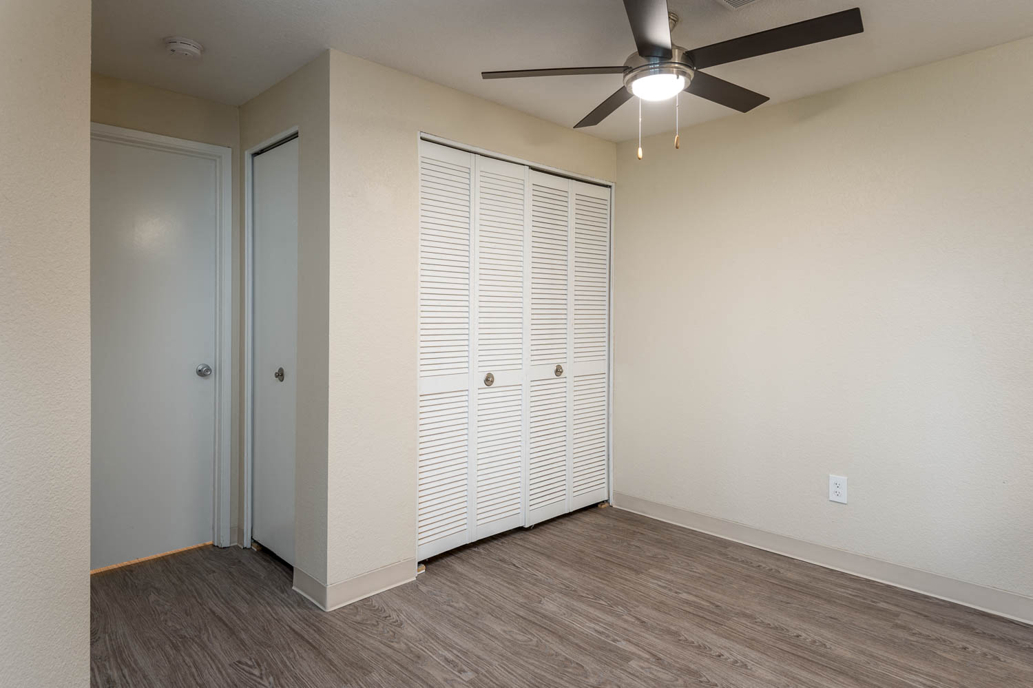 Sundial Apartments | Two Bedroom Dining Room with Plank Style Flooring