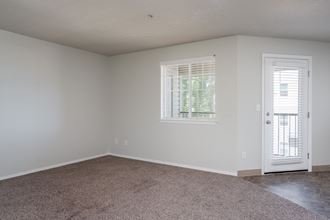 a bedroom with a door and a window