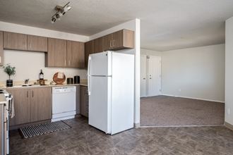a kitchen and living room with white appliances
