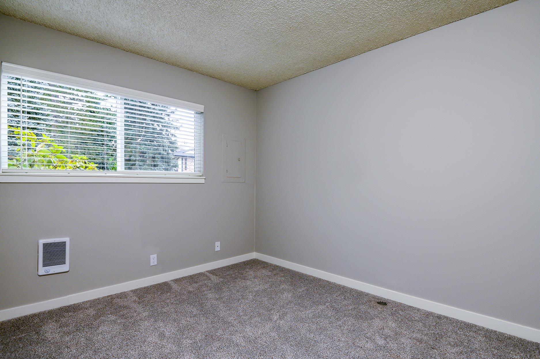 The Hideaway | Bedroom with Wall to Wall Carpet and light filled window