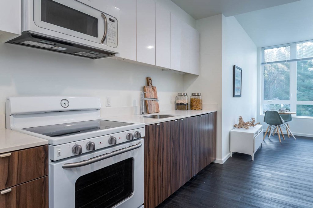 a kitchen with a stove and a microwave