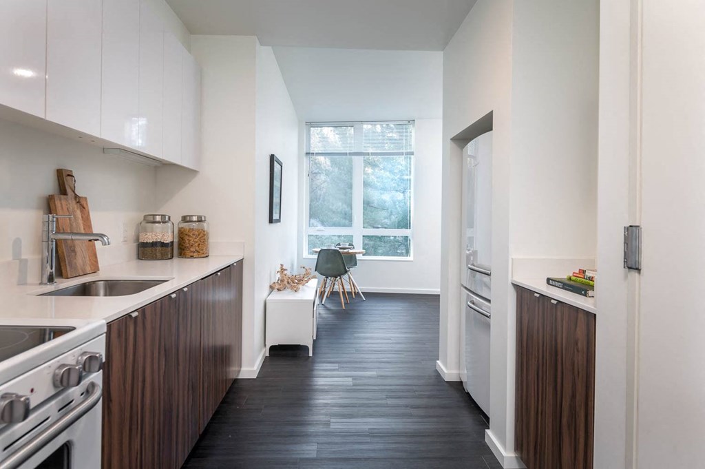 a kitchen with a sink and a window