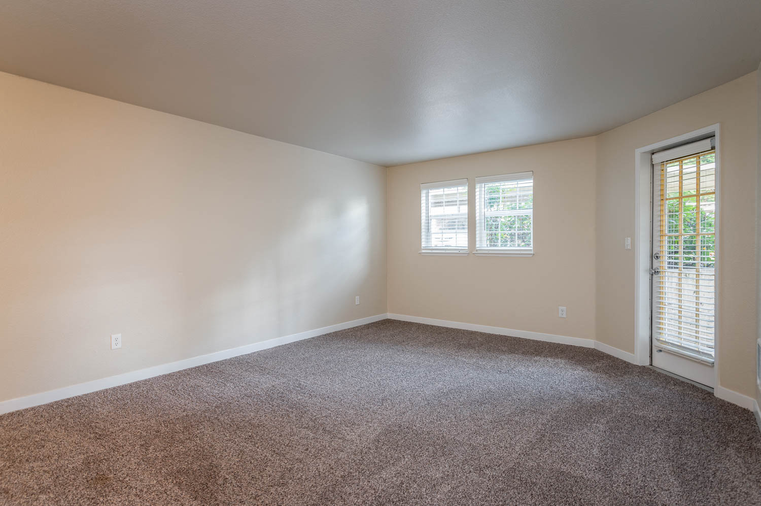 Sundial | Spacious Living Room with Carpeting