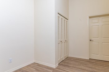 Entryway to apartment with closet and front door.