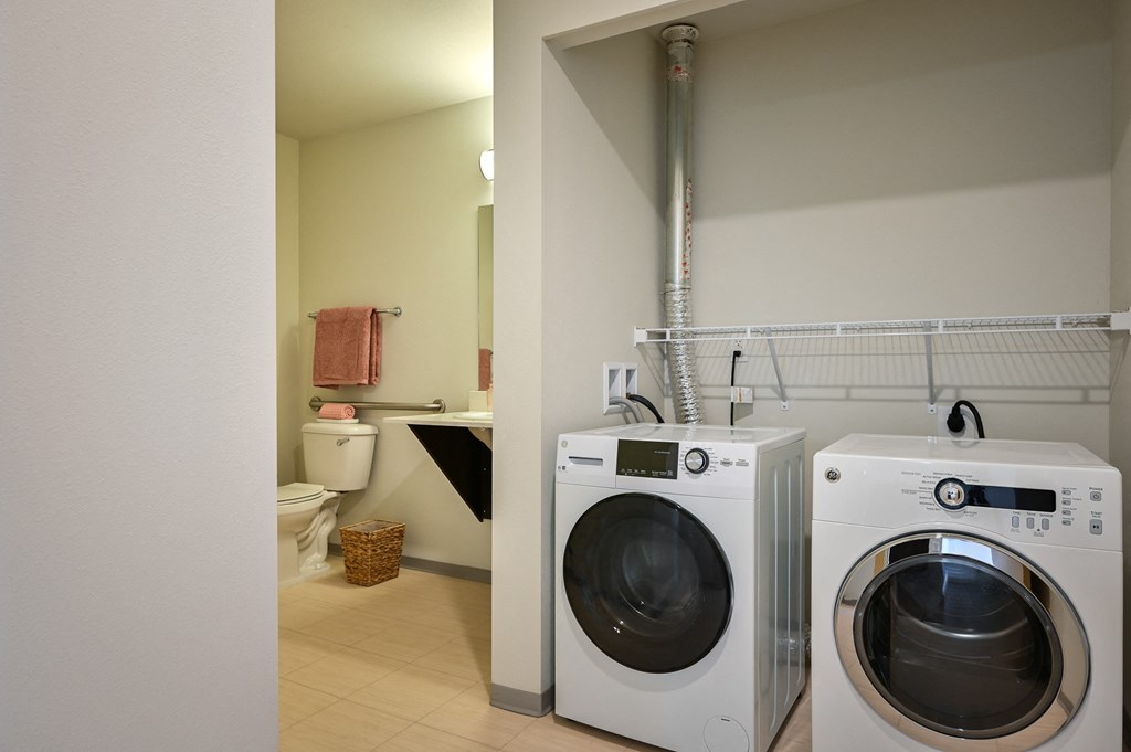 full size washer and dryer in one bedroom at The Waterline