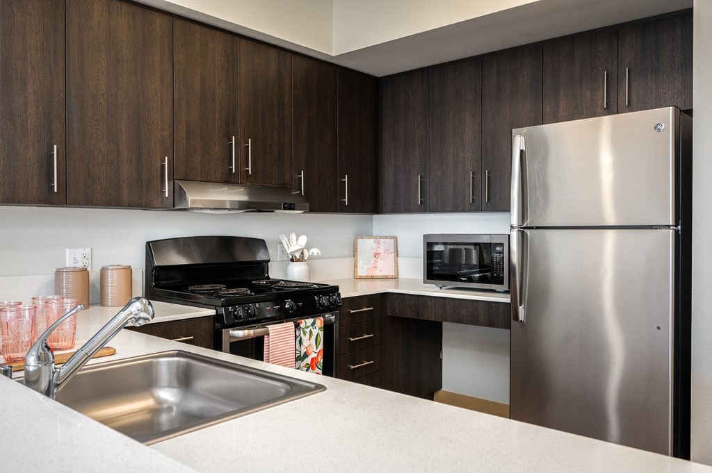a kitchen with stainless steel appliances and a sink