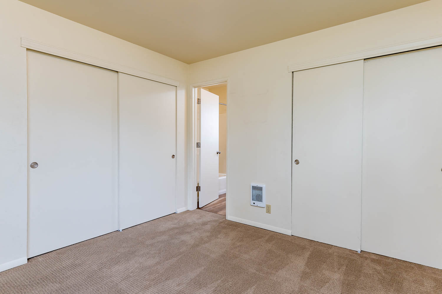 Master Bedroom double closets and wall to wall carpet
