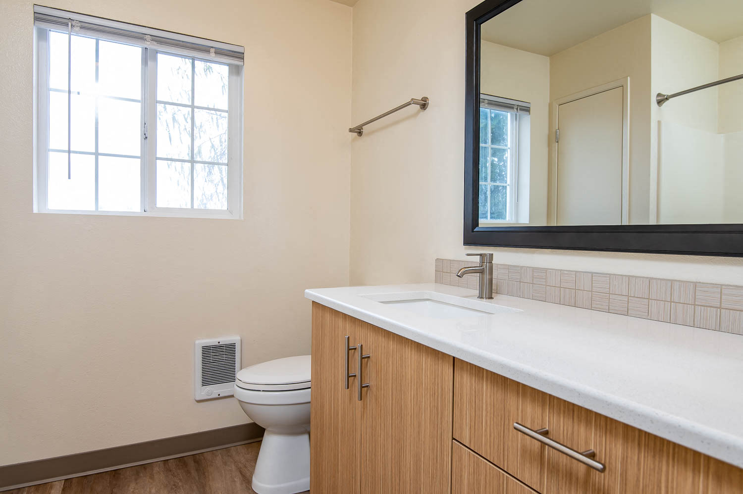 Bathroom with ample storage and large mirror