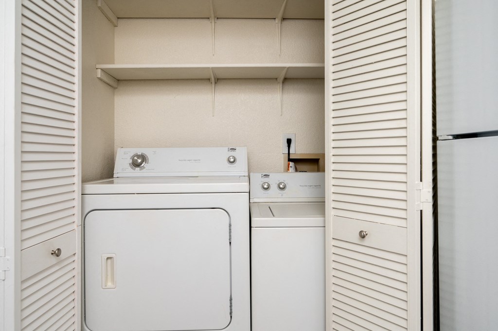 a laundry room with a washer and dryer