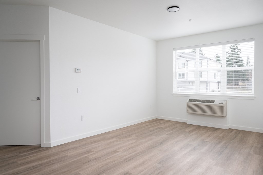 A room with a window and a door.