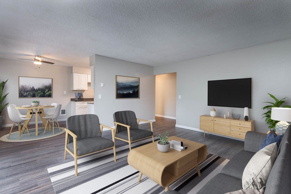 an open living room and dining room with a table and chairs