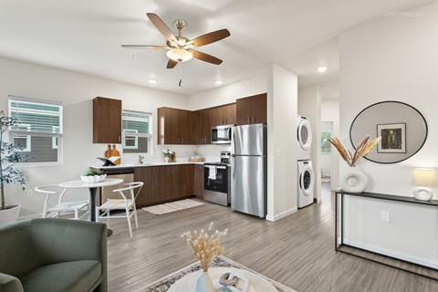 A modern kitchen with a dining table and chairs.