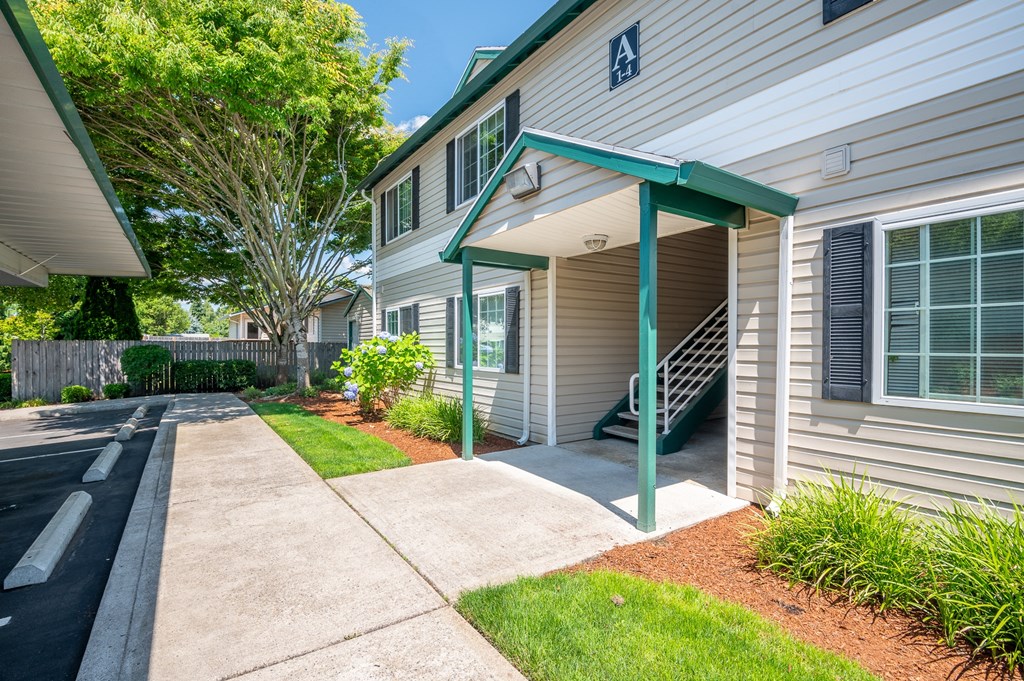 view of exterior entrance with awning and ground level access