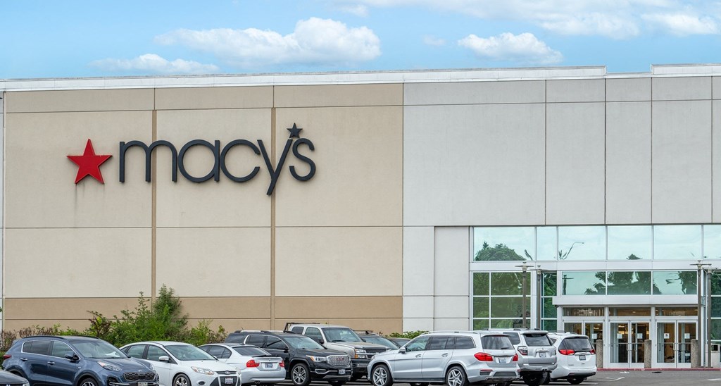 a store with cars parked in front of it