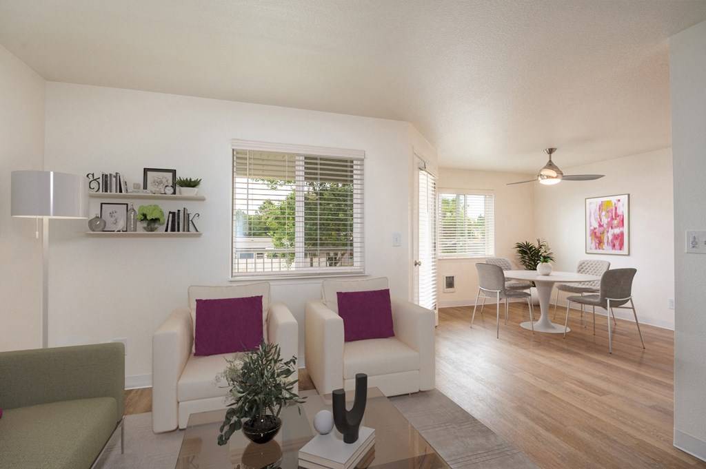 the living room and dining room of an apartment