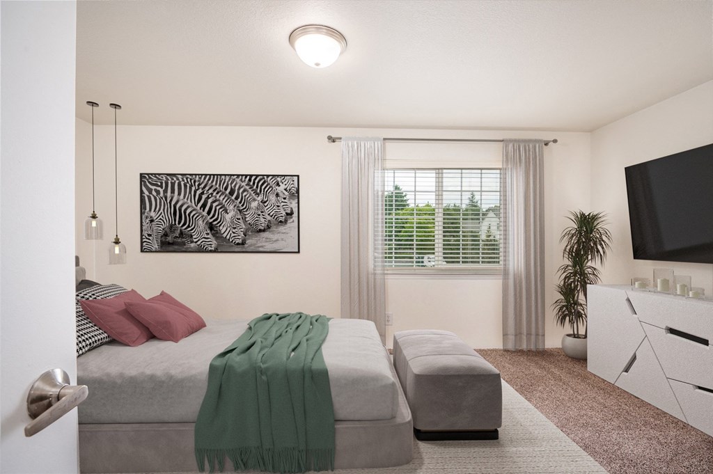 a living room with a bed and a tv