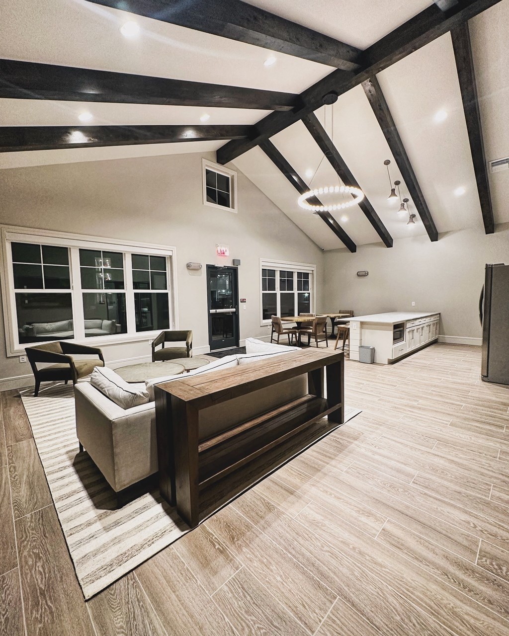 a large living room with a couch and a table