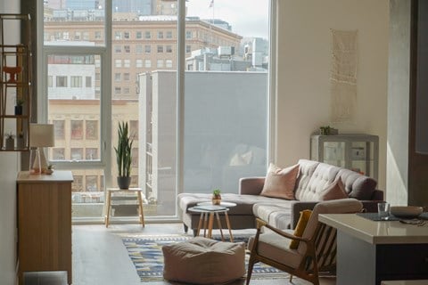 a living room with a couch and a window