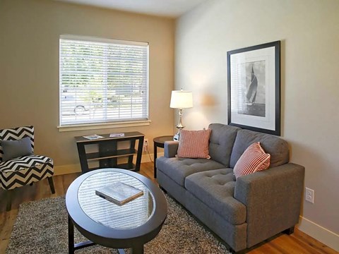 a living room with a couch and a table