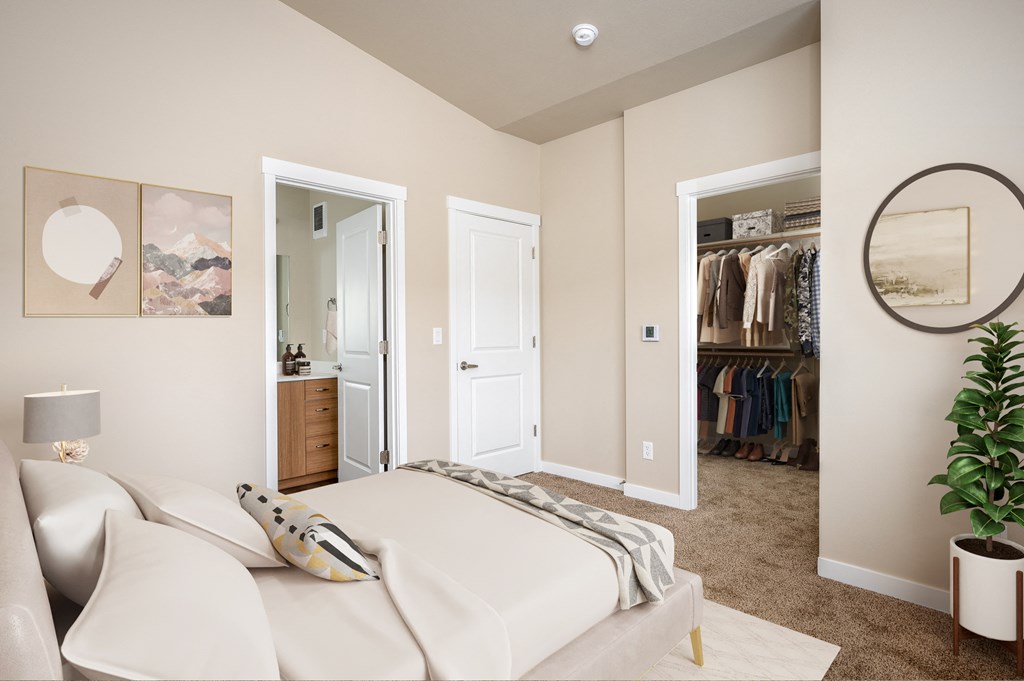 a bedroom with a white bed and a closet
