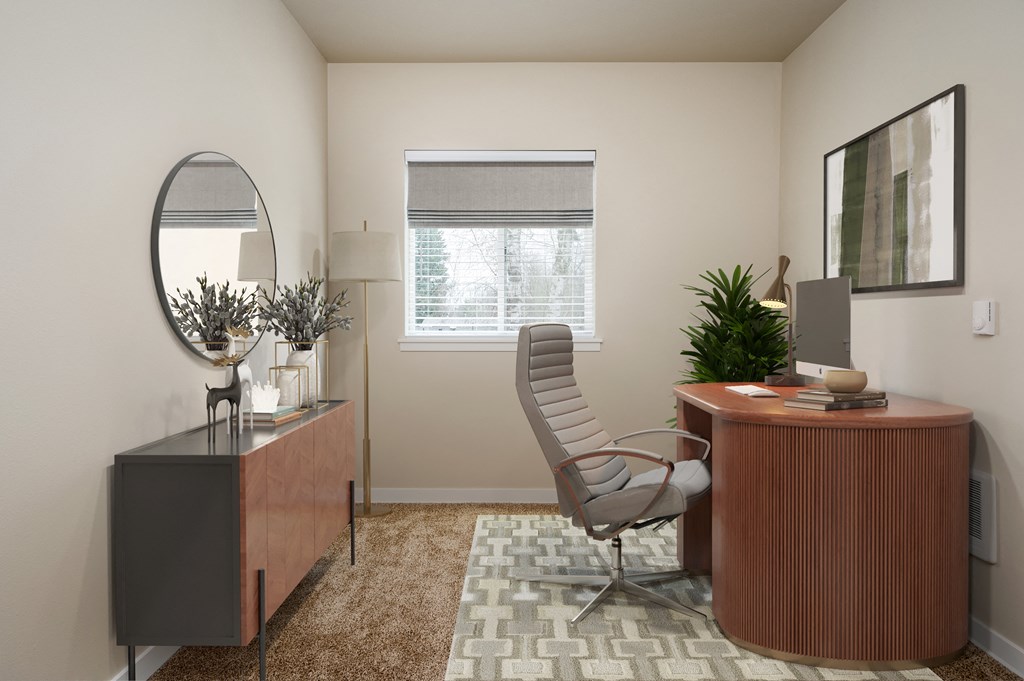 an office with a desk and a chair and a window