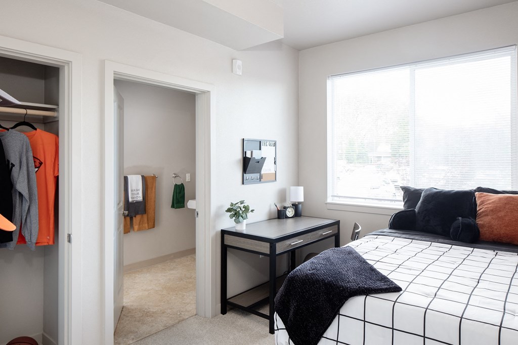 The Quad near OSU - Apartments in Corvallis, OR with wall to wall carpet, white walls, and access to the bathroom