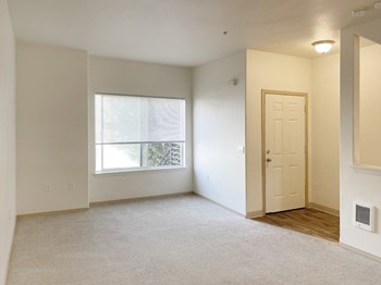 Sunnyview Townhomes| Living Room Area with Large Window - Photo Gallery 3