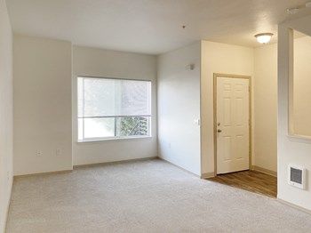 Sunnyview Townhomes| Living Room Area Sunnyview Townhomes| Living Room Area with Large Window - Photo Gallery 3