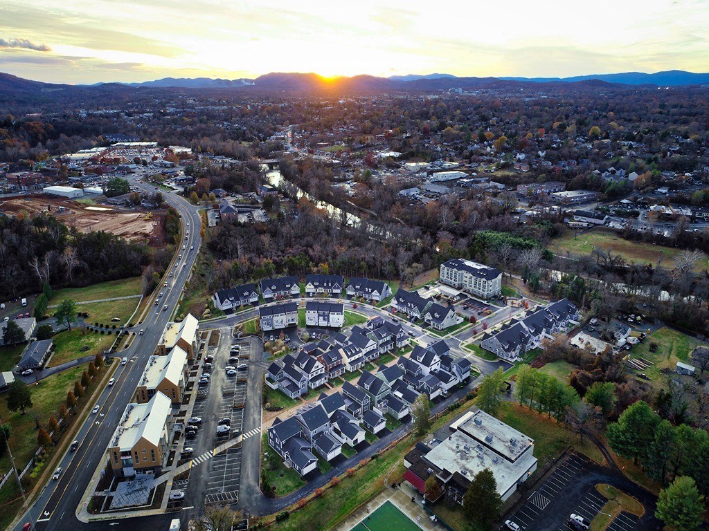 an aerial view of a city at sunset