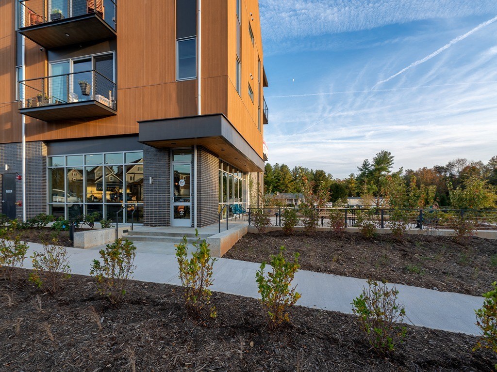 the facade of a building with trees in the background