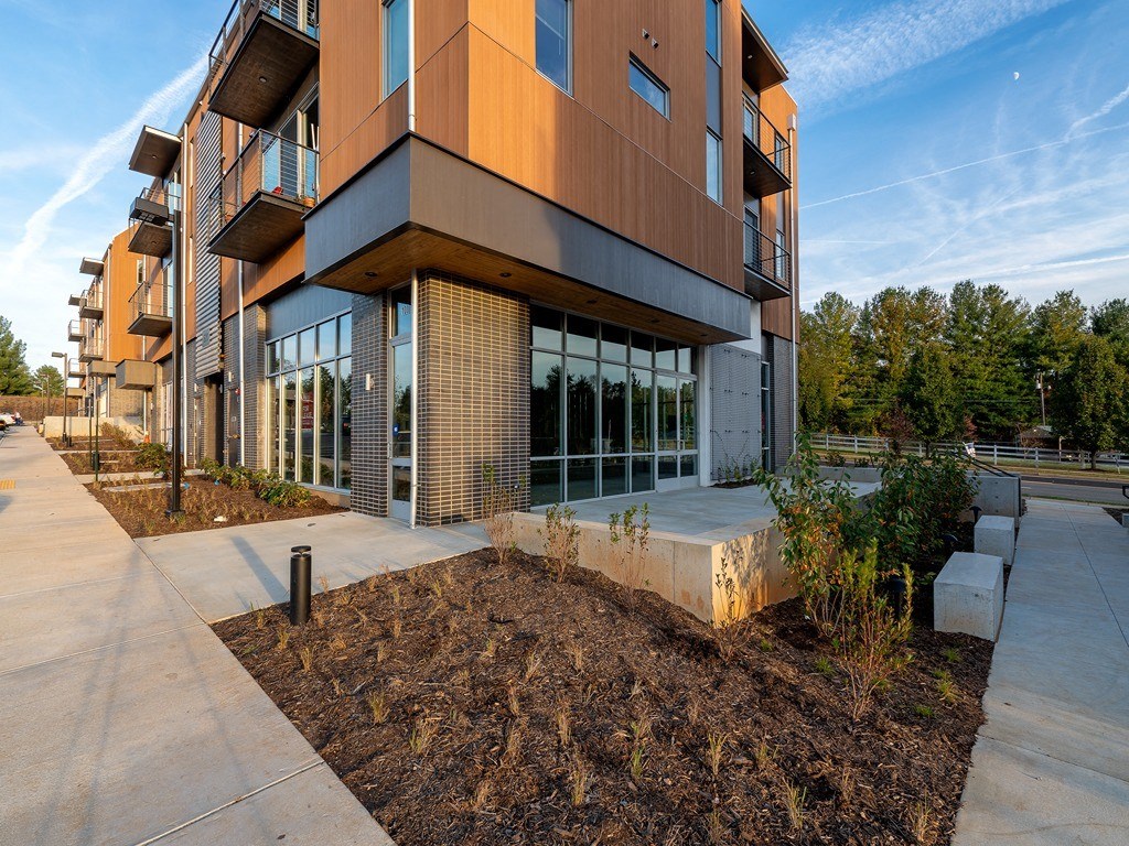 a building with a sidewalk in front of it