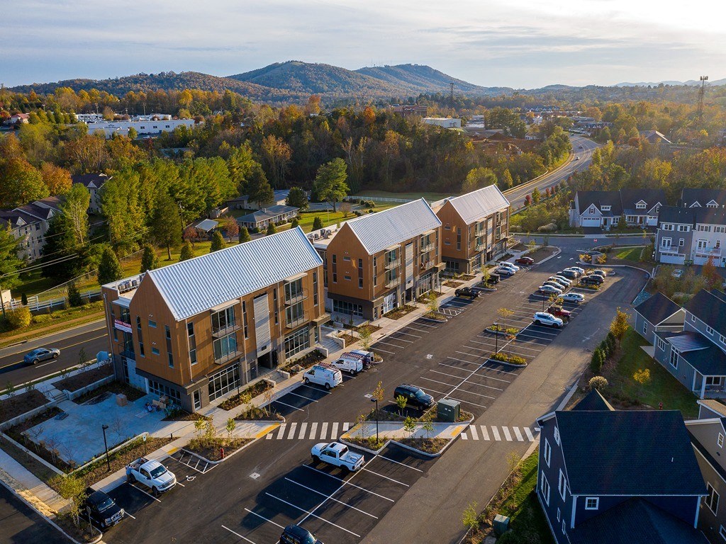 an aerial view of apartment buildings on a city street