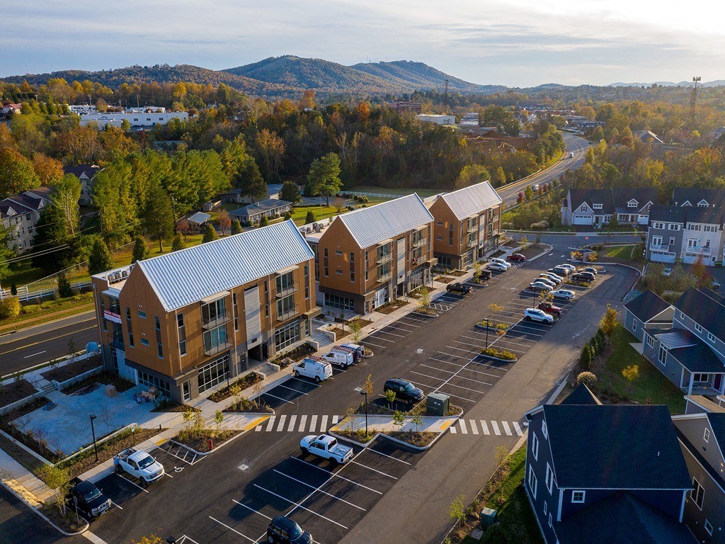 an aerial view of apartment buildings on a city street
