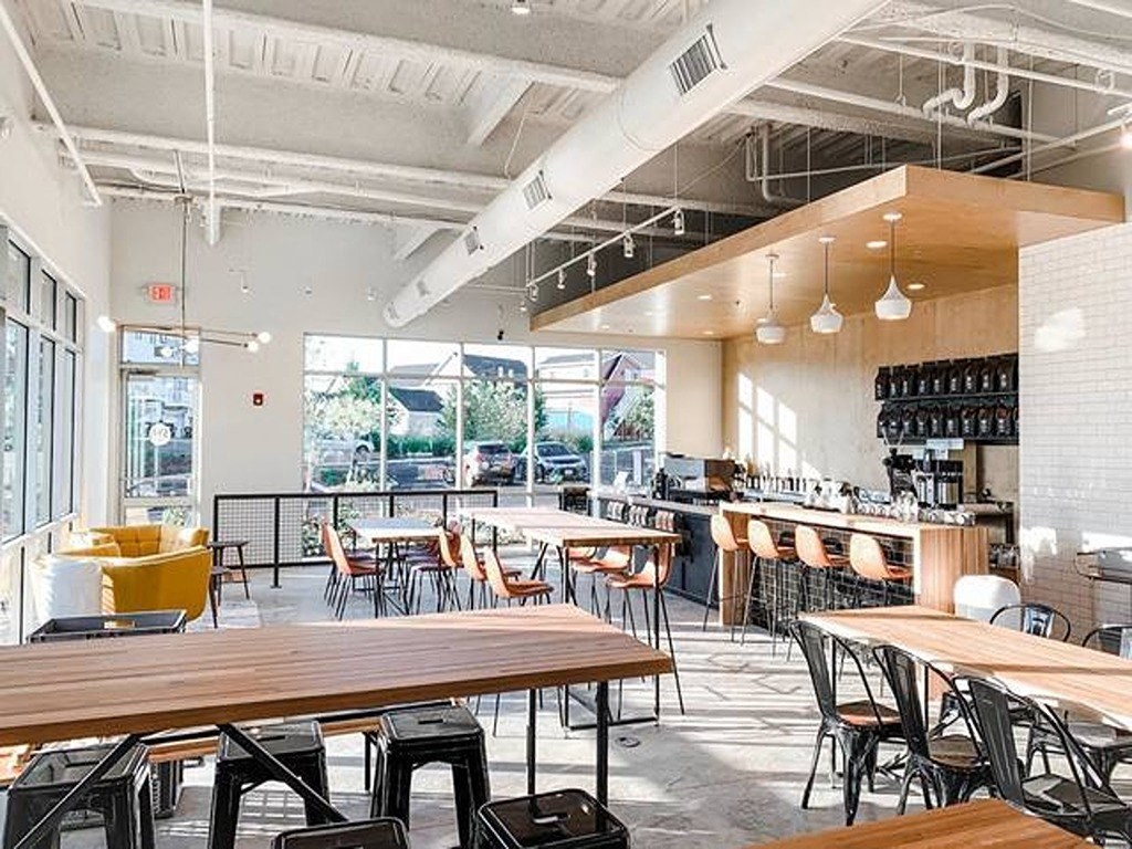 a restaurant with tables and chairs and a bar