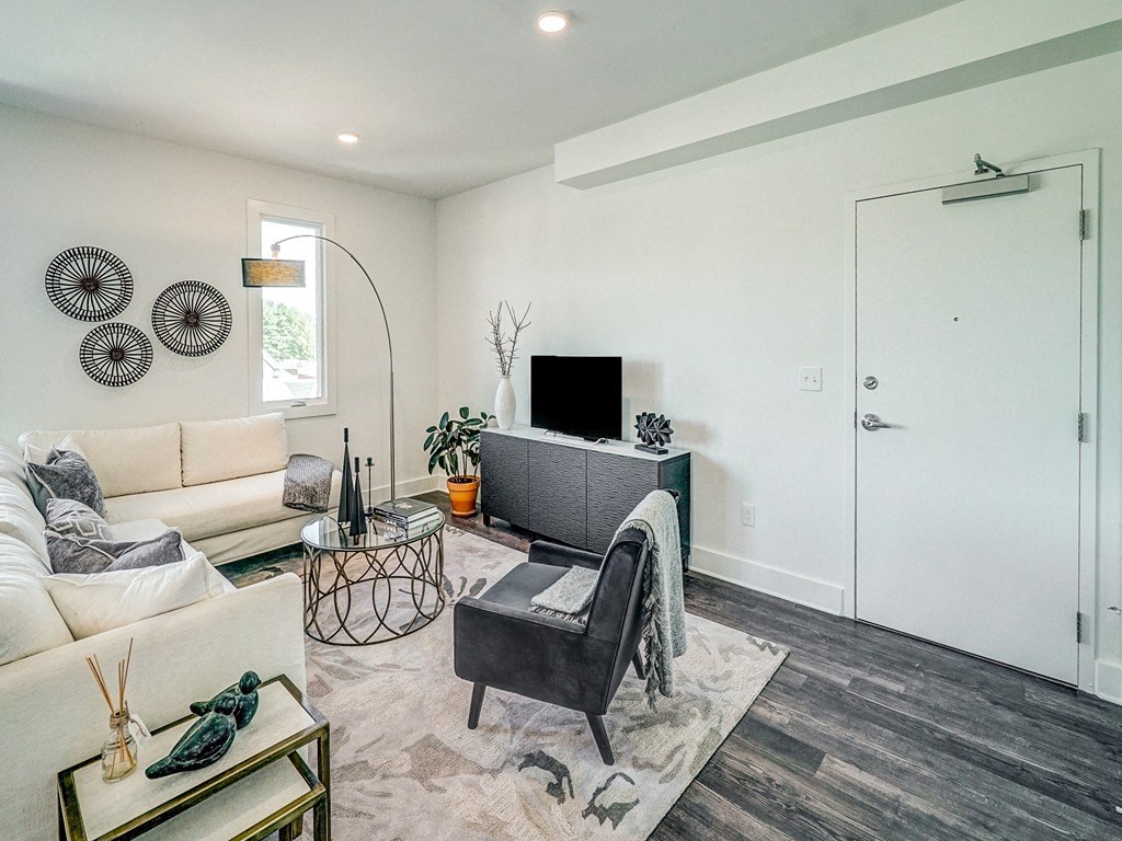 a living room with a couch and a tv