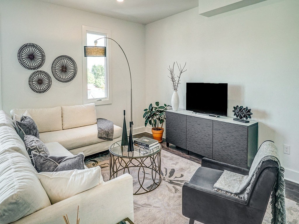 a living room with a couch and a tv