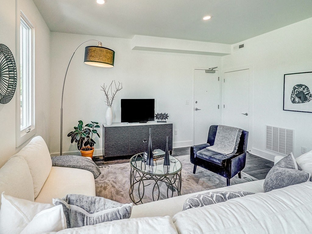 a living room with a couch and a tv