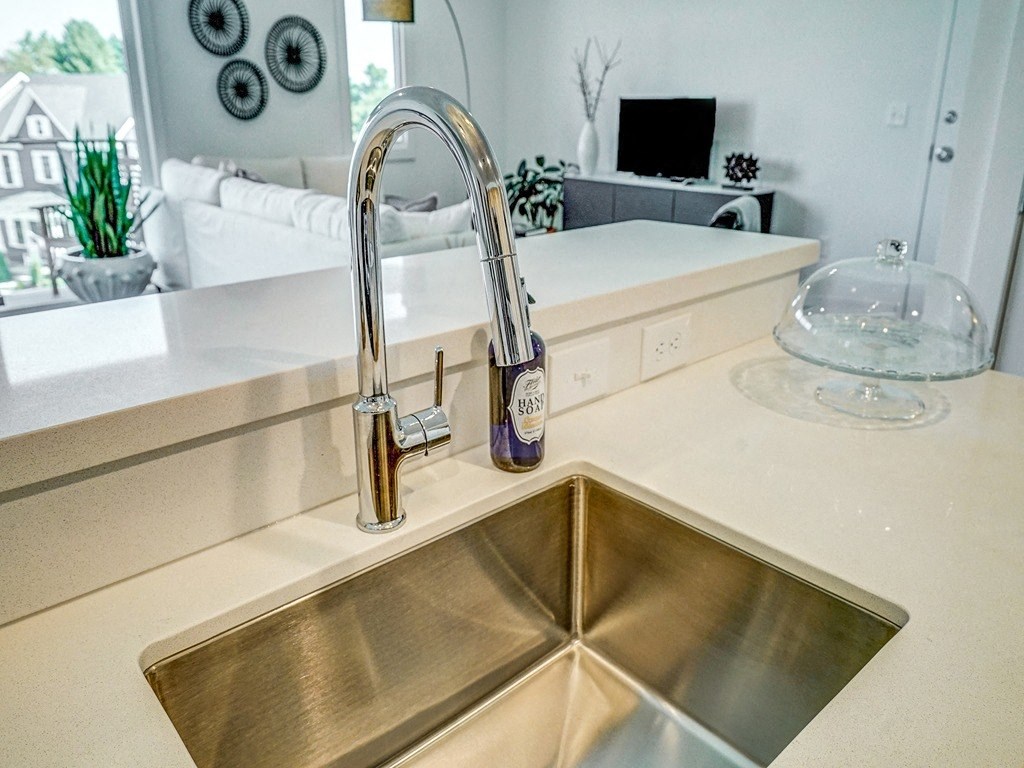 a kitchen with a sink and a faucet