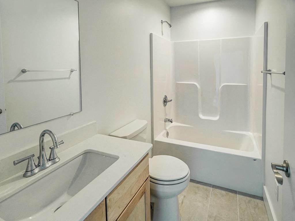 a bathroom with a sink toilet and a shower