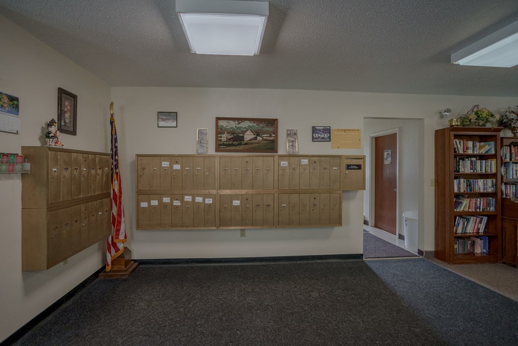 a view of the library with lockers and a flag