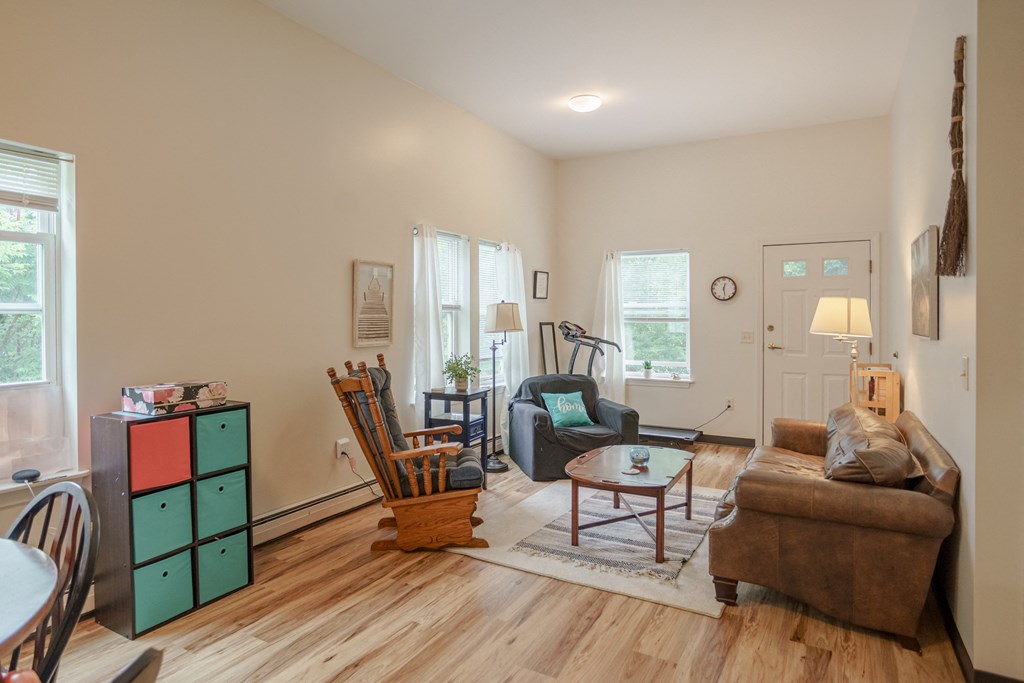 a living room with a couch and a chair and a table